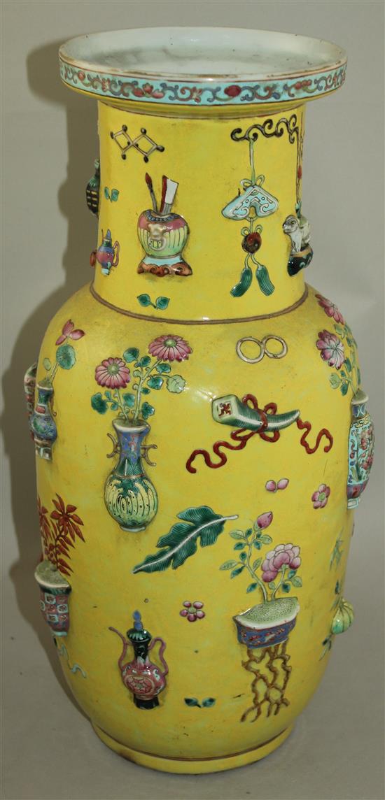 A large Chinese yellow ground and moulded Hundred Antiques vase, 19th century, 44cm